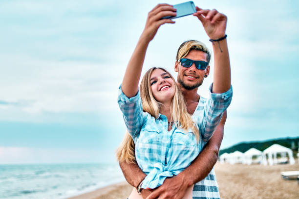 istock Young Couple taking selfie at vacation 1138928317