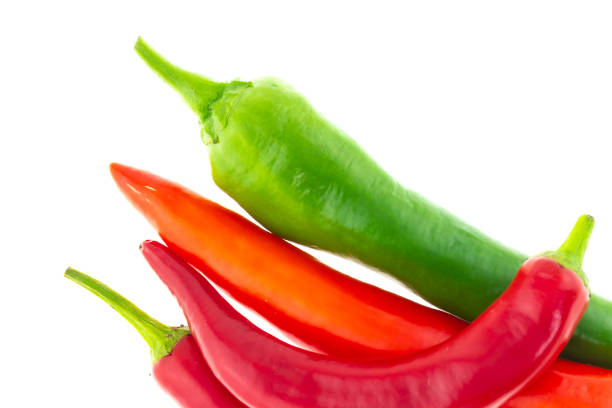 istock vegetables sharp long chili peppers red green contrast on a white background 1138932336