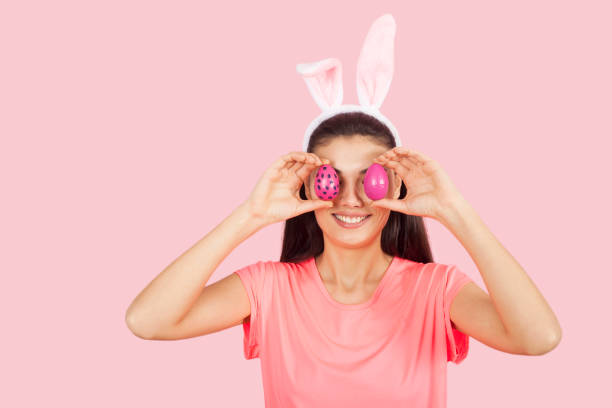 istock beautiful woman with bunny ears 1138935942