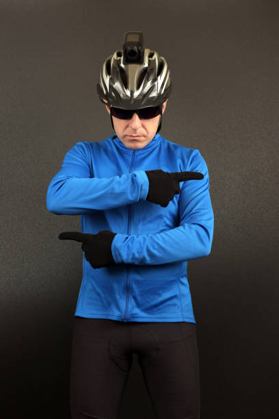 istock male cyclist in top form indicates his hands in different directions 1138937203