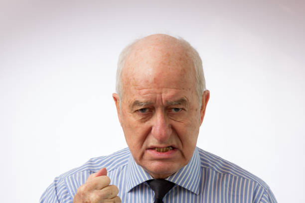 istock Senior man looking unhappy and threatening 1138939139