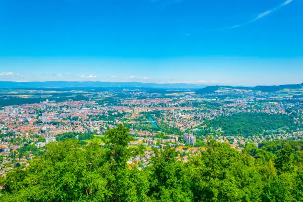 View from Gurten hill on Bern dominated by Münster cathedral and Bundeshaus, Switzerland
