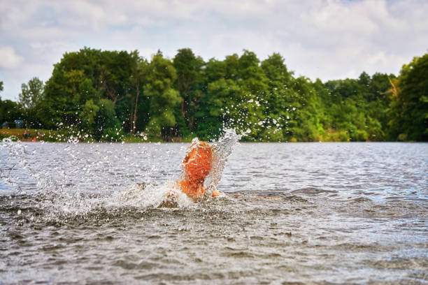 istock Drowning child while swimming in a lake. 1138942126