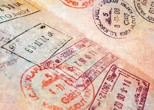 Passport stamps Passport page with border stamps - tourism background schengen agreement stock pictures, royalty-free photos & images