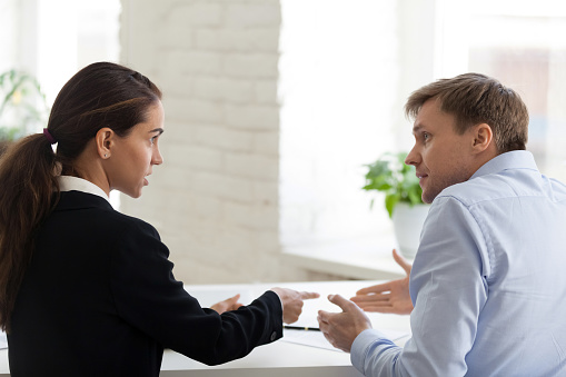 Conflict of female boss and male office worker. Angry bossy business woman shout at irritated man, bad worker. Problem, mistake, stress, depression, overworked, frustrated. People at workplace concept
