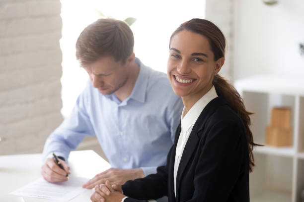 happy smiling businesswoman making good business deal - business looking at camera office new imagens e fotografias de stock