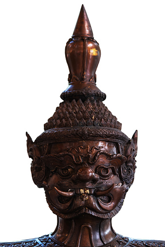 Close up of Face of Tos-Sa-kan from Ramakian isolate on white background. Brass statue of the giant statue in Thai style, thailand literature Ramayana traditional.