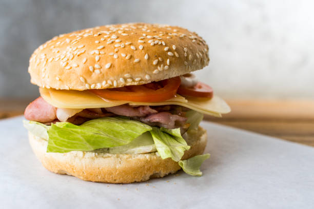 istock bacon burger on wooden table gray background 1138947684