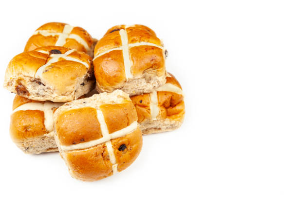 istock Pile of fresh hot cross buns isolated on white 1138949140