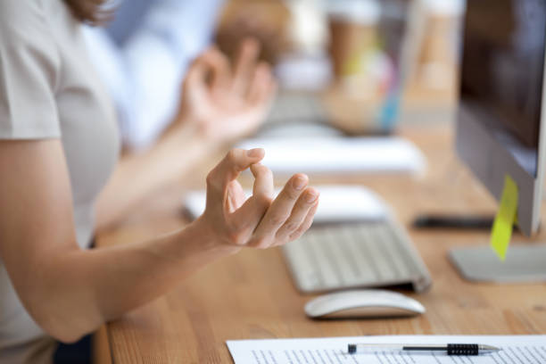 istock Female doing yoga during working day in office 1138949177