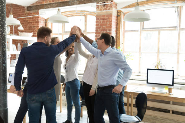 istock Businesspeople standing giving high five celebrating great results 1138949181