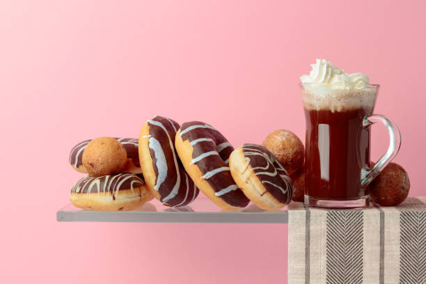 istock Chocolate donuts and hot chocolate with cream. 1138950679