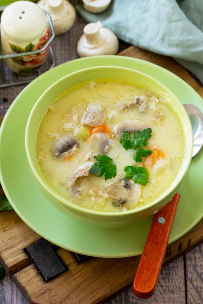 istock Cream soup with cream, chicken and mushrooms on a rustic-style kitchen table. Copy space. 1138952801