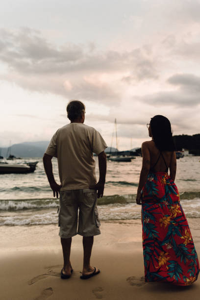 istock People at sunset on the beach 1138953290