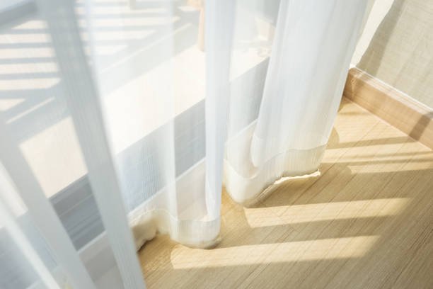 istock morning sunlight through curtain in room 1138973114