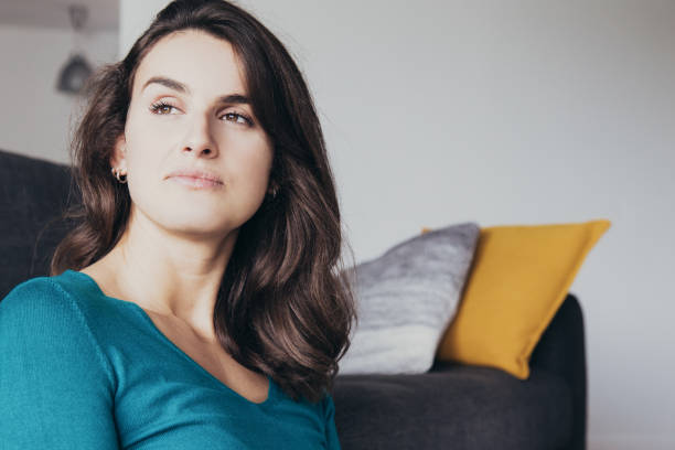 istock Pensive dreamy girl resting at home 1138977746