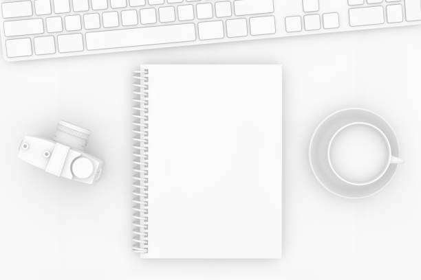 istock Top view of notebook with camera and keyboard on white background 1138979330