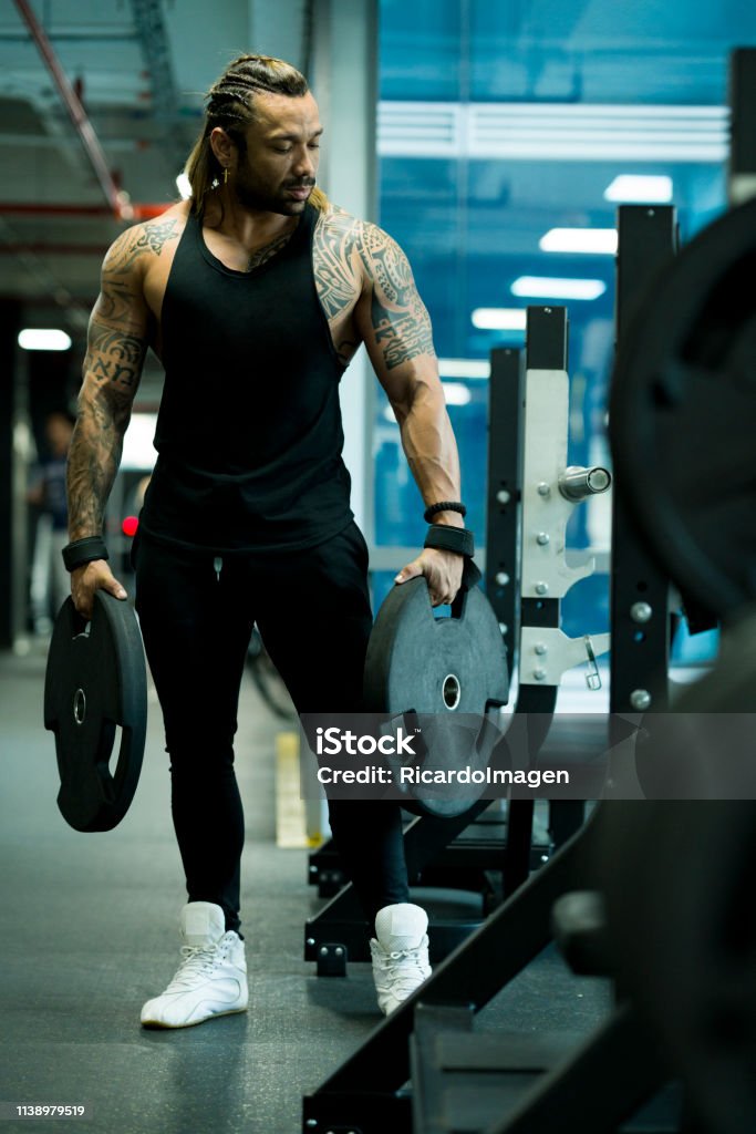 Man Machine Loading Man Loading The Machine To Begin His Training Stock Photo - Download ...