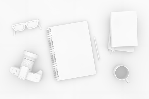 3d rendering of white color notebook with camera and books on white background. Office desktop, Workplace, Home Office.