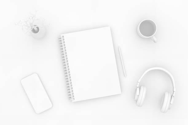 istock Top view of notebook with headphones and smartphone on white background 1138979676