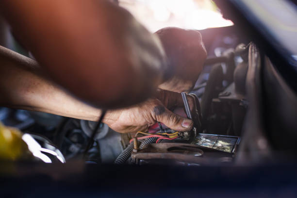 istock Car service ,fitting a car battery with wrench 1138979696