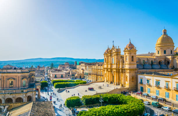 Aerial view of Noto including Basilica Minore di San Nicolò and Palazzo Ducezio, Sicily, Italy Aerial view of Noto including Basilica Minore di San Nicolò and Palazzo Ducezio, Sicily, Italy noto sicily stock pictures, royalty-free photos & images