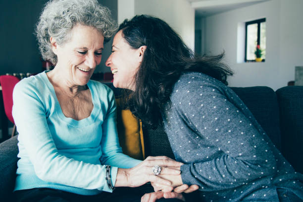 istock Positive elderly woman and her daughter having fun 1138981932
