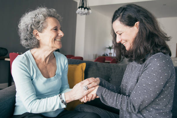 istock Positive elderly woman and her daughter chatting 1138981936
