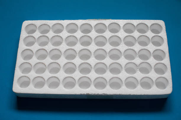istock Styrofoam for contact lenses in bottles or another small breakable items like test tubes on blue background 1138982404