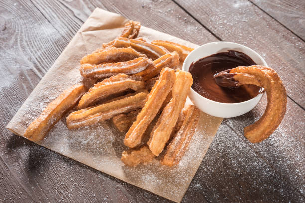 istock Churros with sugar and chocolate sauce 1138984215