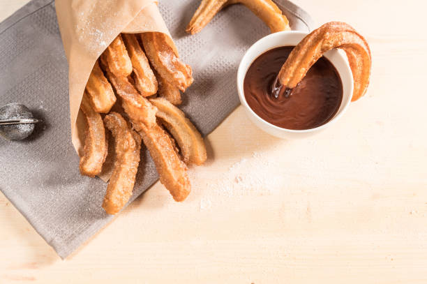 istock Churros with sugar and chocolate sauce 1138984217