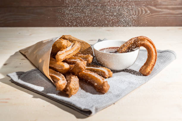istock Churros with sugar and chocolate sauce 1138984239