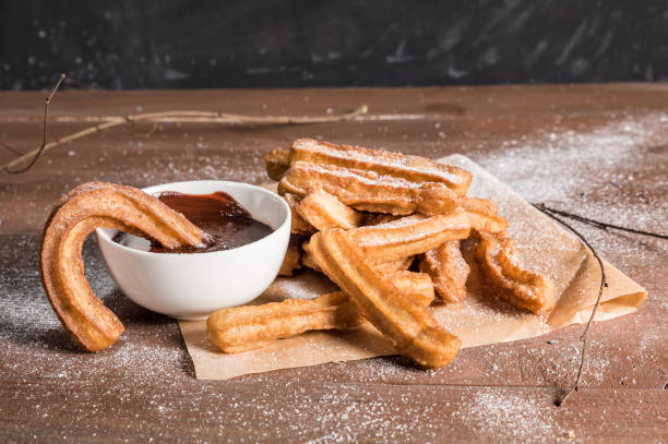 istock Churros with sugar and chocolate sauce 1138984242