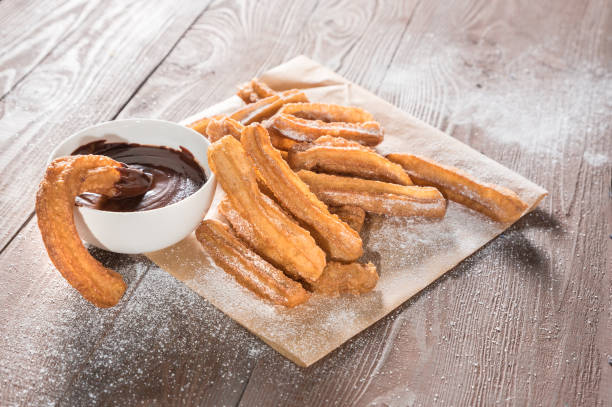istock Churros with sugar and chocolate sauce 1138984244