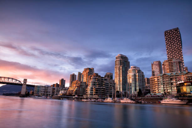 False creek at sunset, Vancouver, Canada False Creek in Spring in Vancouver, Canada, taken from Granville Island. sound port stock pictures, royalty-free photos & images