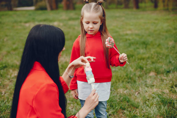 istock mother and daughter in a park 1138986283