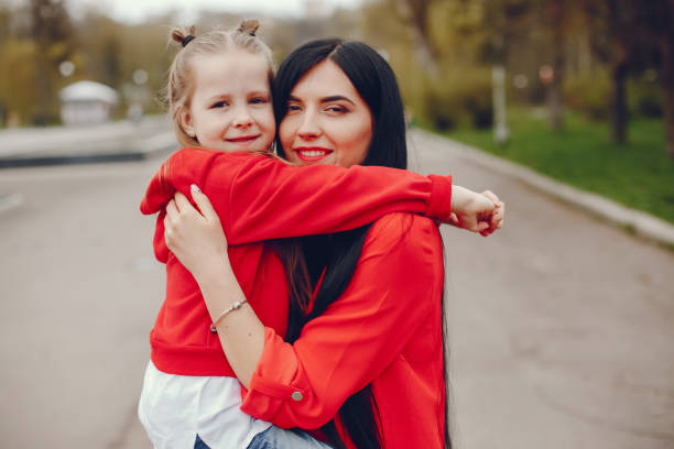 istock mother and daughter in a park 1138987341