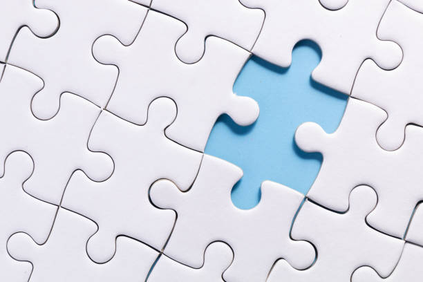 jigsaw close up white jigsaw and missing one part of jigsaw on blue color background with concept incomplete stock pictures, royalty-free photos & images