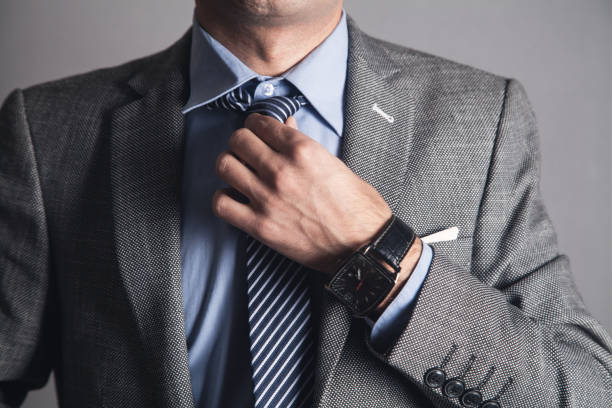 istock Business Man fixing his tie. 1138994356
