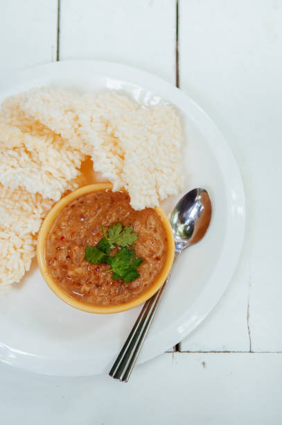 istock Thai crispy rice cake with shrimp tamarind peanut sauce - Thai traditional snack 1138994607