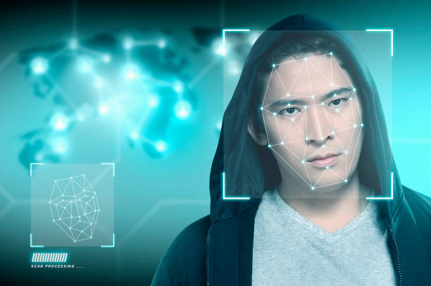 istock Young asian man in black hoodie using face recognition 1138994697