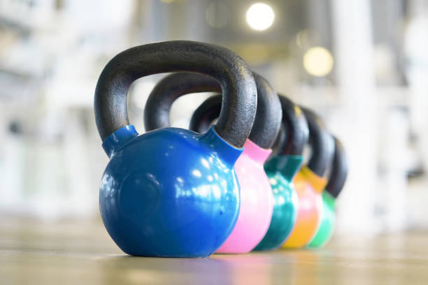Colorful kettlebells in gym