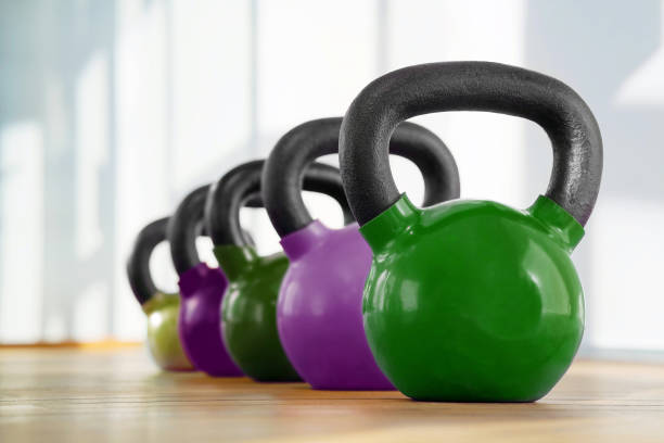 istock Colorful kettlebells in gym 1138997800