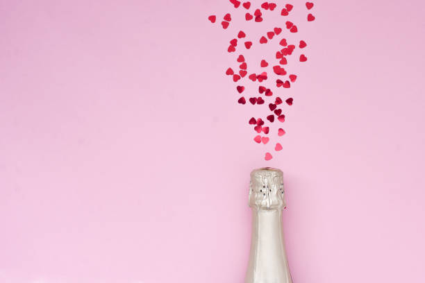 Champagne Bottle With Glittering Splashes On Color Background Stock Photo -  Download Image Now - iStock