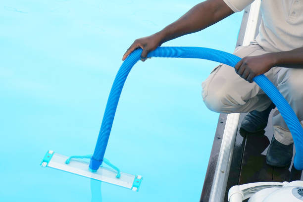 istock Hotel staff worker cleaning the pool 1138997904