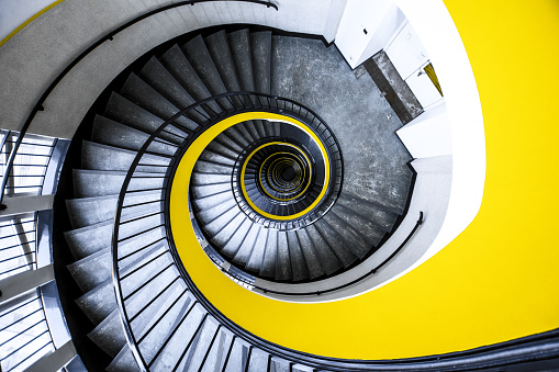 Epic downwards yellow staircase at a hospital in Lille Belgium.