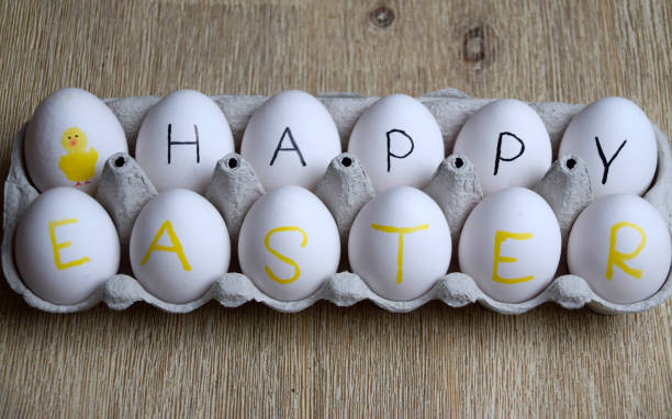 istock Happy Easter wishes written on raw eggs in a box 1139003495