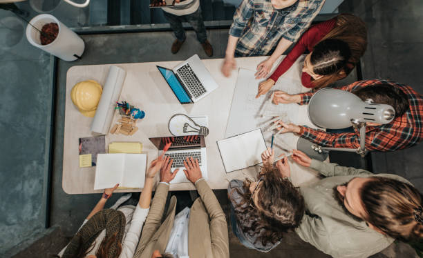 istock Above view of architects working on a meeting in the office. 1139005322