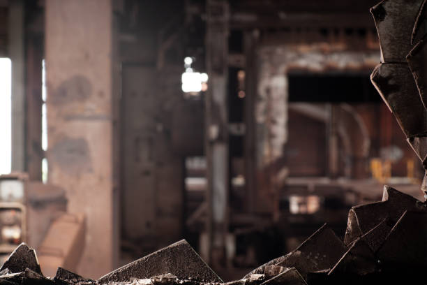 istock Broken glass in window frame looking out into an abandoned factory 1139011280
