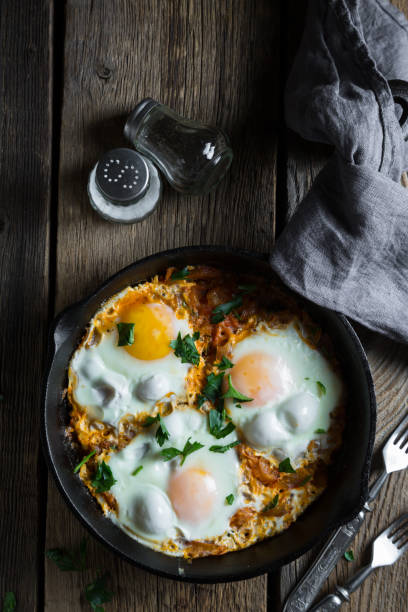 istock Shakshuka, scrambled eggs in roasted tomato sauce 1139011612